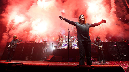 Ozzy Osbourne performing live with Black Sabbath during an energetic heavy metal concert