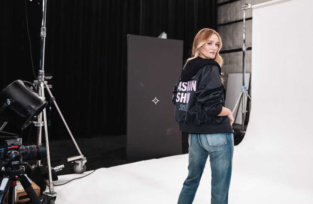 Rosie Huntington-Whiteley backstage in a black Victoria's Secret 2026 jacket preparing for a fashion shoot