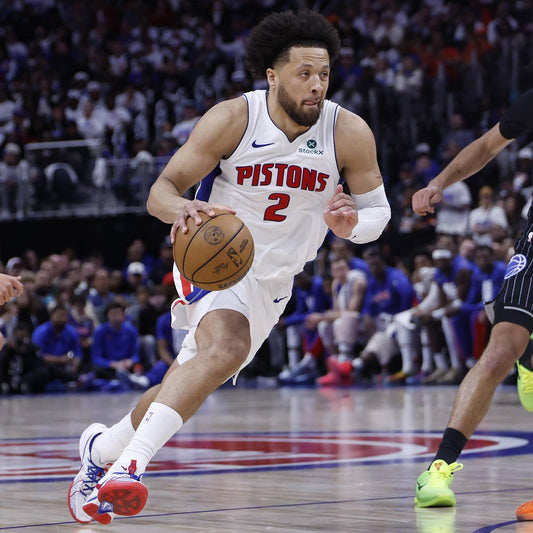 Cade Cunningham dribbling in his Detroit Pistons white uniform during the 2026 NBA playoffs