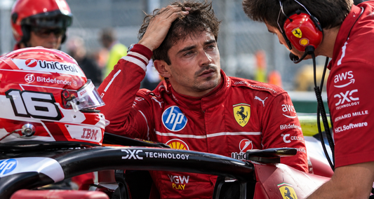 Charles Leclerc with Ferrari team after a Formula 1 incident