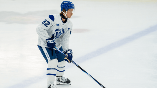 Gavin McKenna skating in a white Toronto Maple Leafs practice jersey in September 2026