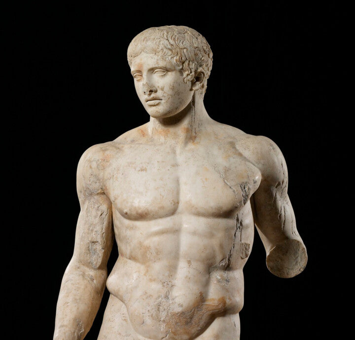 Muscular classical Greek athlete statue emphasizing broad balanced shoulders
