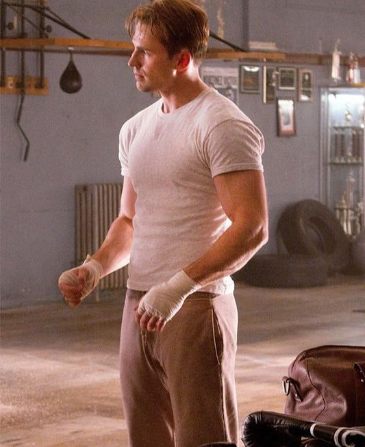 Chris Evans in his Captain America era showing the broad-shouldered, muscular super-soldier physique