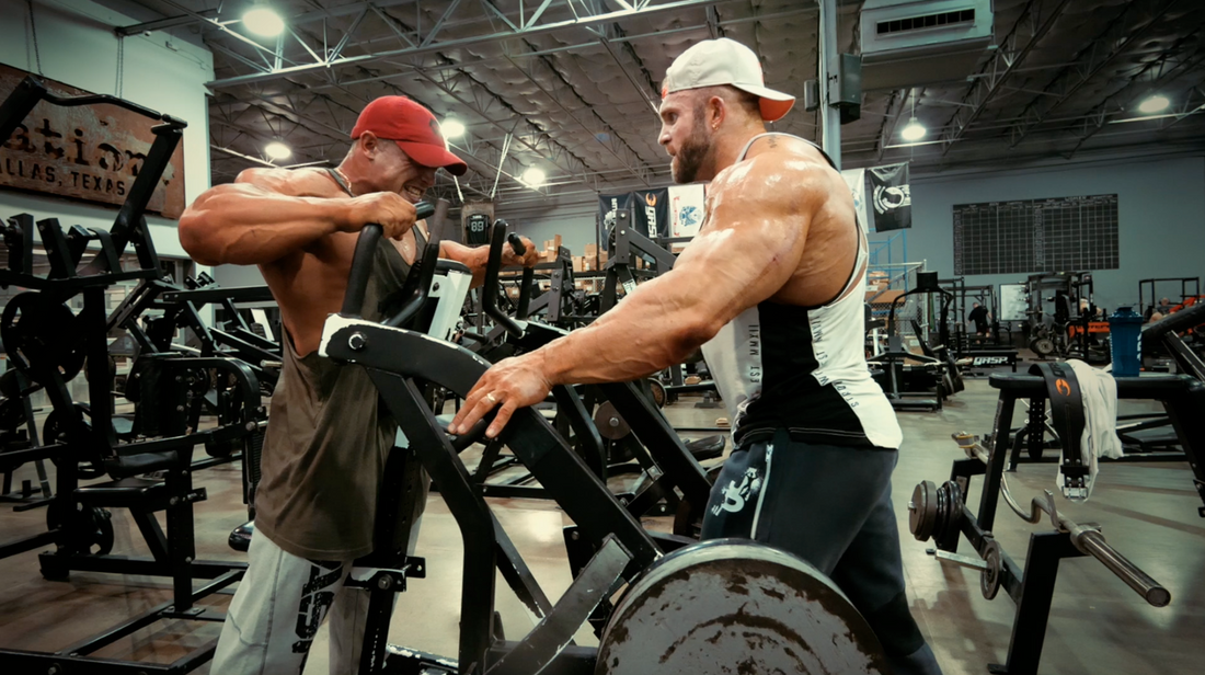 Iain Valliere coaching a heavy rowing-machine workout in the gym