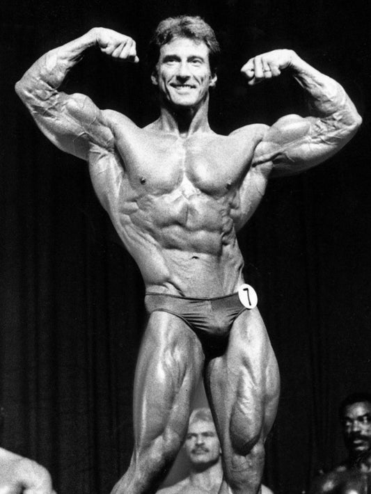 Frank Zane posing with a classic wide-shouldered V-taper physique