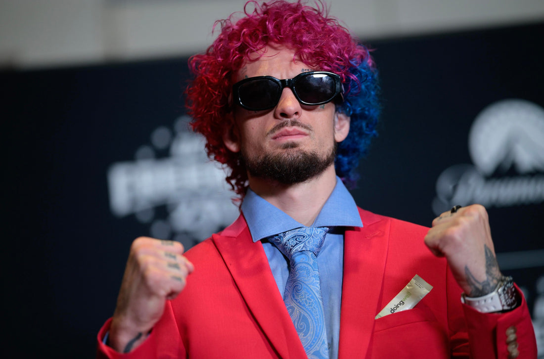 Sean O'Malley addresses the media in a red suit at a June 2026 UFC Freedom 250 event