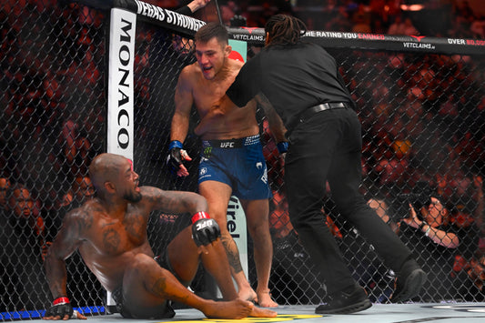 Esteban Ribovics after the UFC 332 fight with Herb Dean nearby