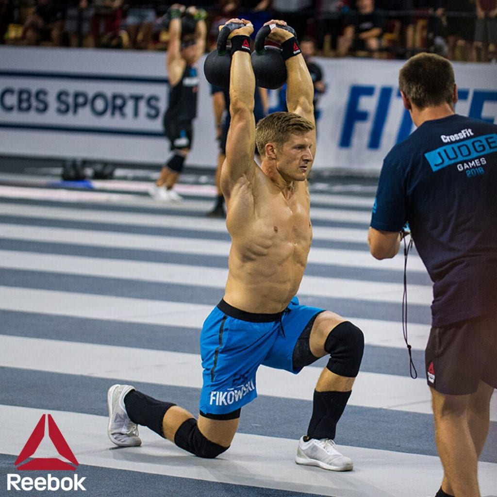 Brent Fikowski performing a controlled overhead kettlebell lunge at the 2018 CrossFit Games