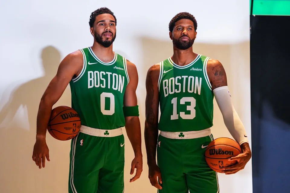 Paul George and Jayson Tatum wearing Boston Celtics uniforms at 2026 media day