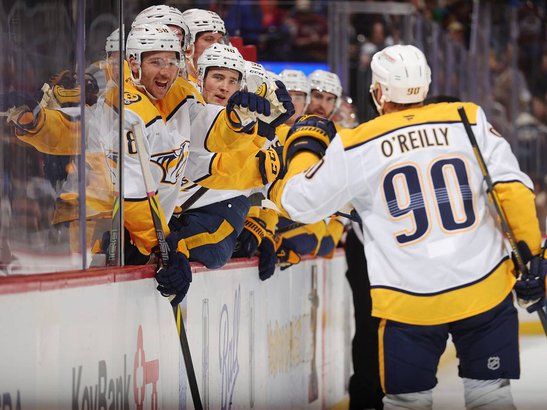 Ryan O'Reilly celebrates with Nashville Predators teammates on the ice
