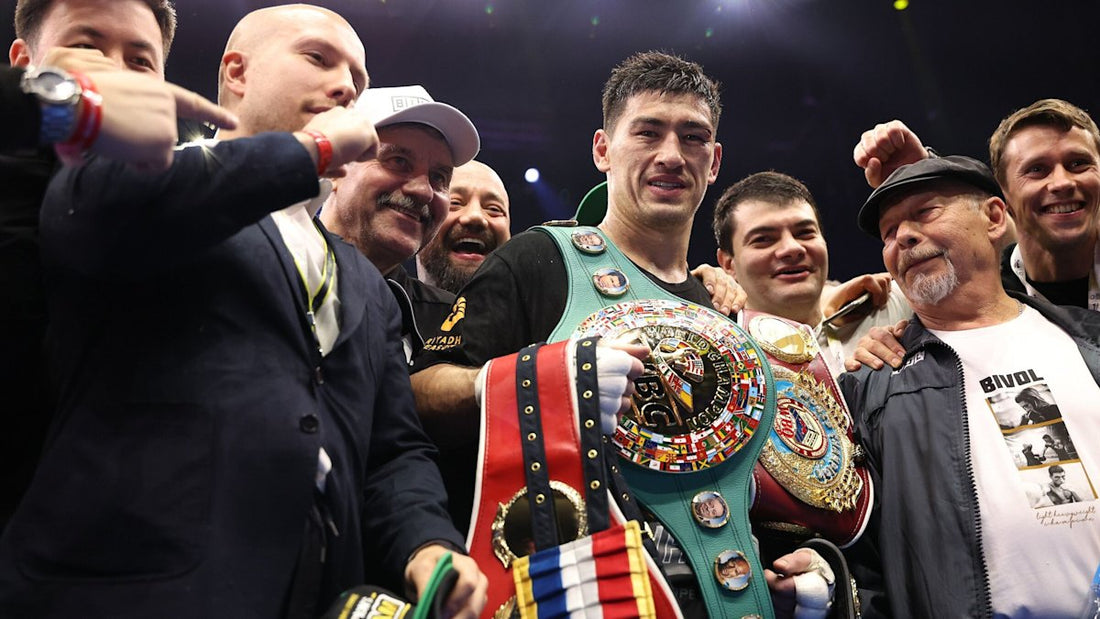 Dmitry Bivol poses with championship belts after his 2025 undisputed victory