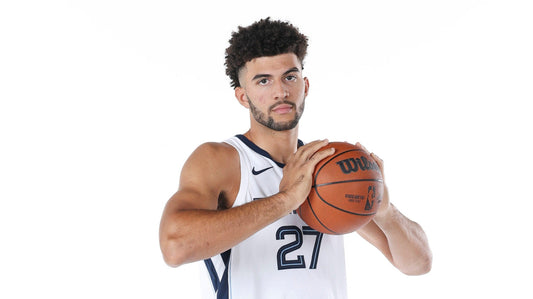 Cameron Boozer holding a basketball in his white Memphis Grizzlies No. 27 jersey at 2026 media day