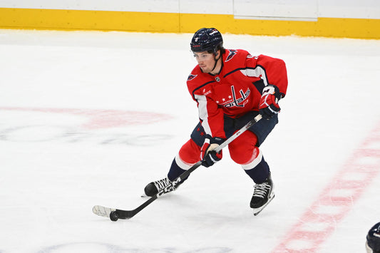 Ryan Leonard in Washington Capitals gear carrying the puck during the 2026 season
