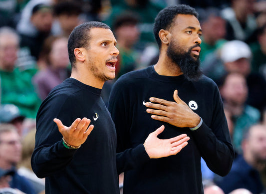 Joe Mazzulla and Tony Dobbins on the Boston Celtics sideline in November 2025