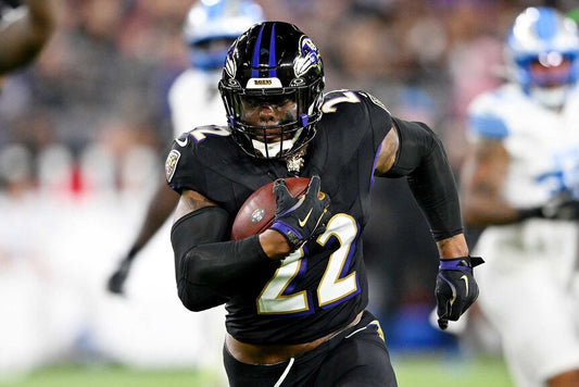 Derrick Henry carrying the football for the Baltimore Ravens
