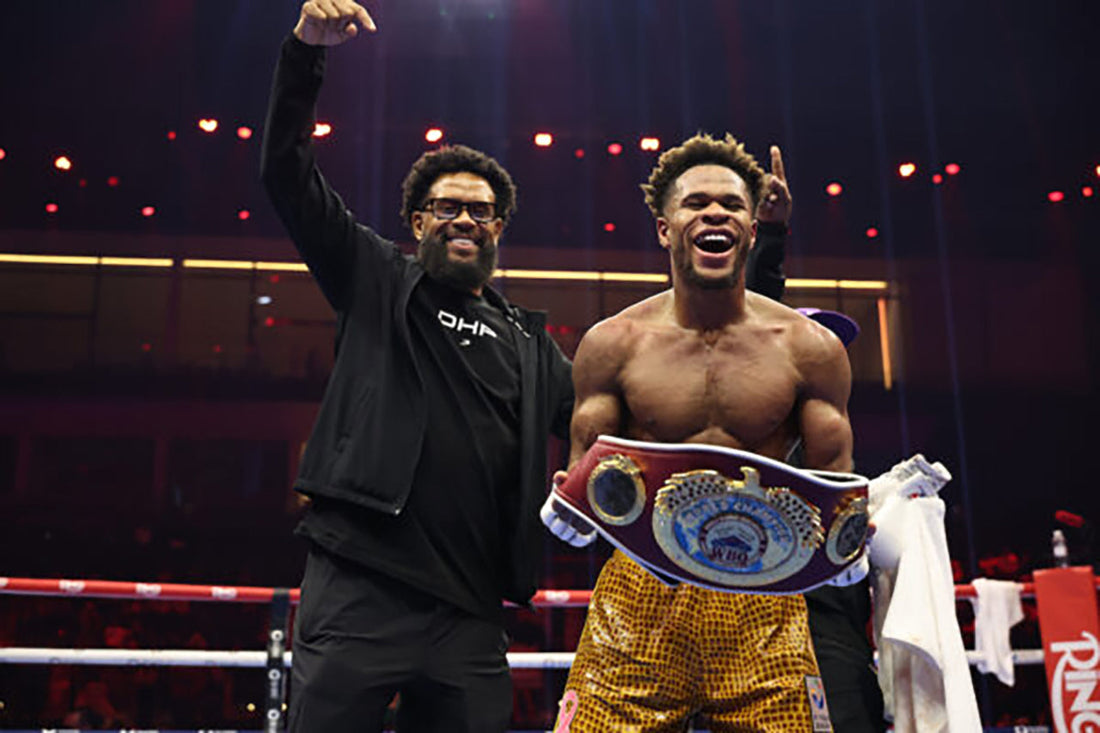 Devin Haney and his father Bill with a championship belt in 2026
