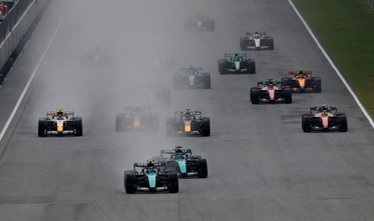 Formula 1 cars driving through heavy rain at Sepang during the October 2026 Bahrain Grand Prix in Malaysia