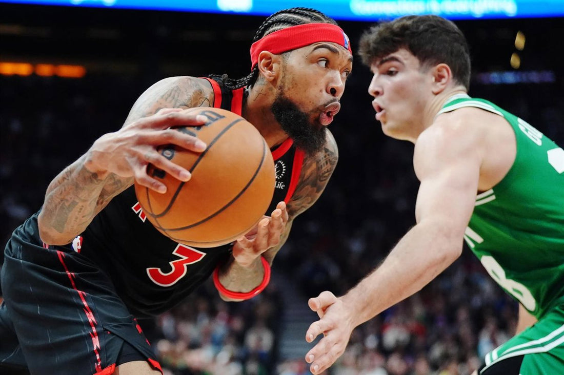 Hugo González in a Boston Celtics jersey defending against Philadelphia during a 2026 NBA game