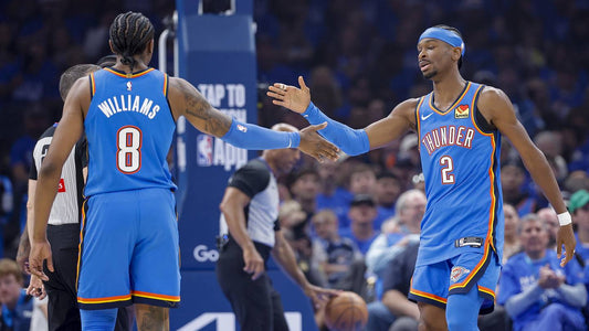 Jalen Williams and Shai Gilgeous-Alexander greet each other in Oklahoma City Thunder blue uniforms during the 2026 playoffs