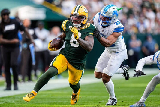 Josh Jacobs in Green Bay Packers uniform carries the ball against Detroit Lions in a 2025 game