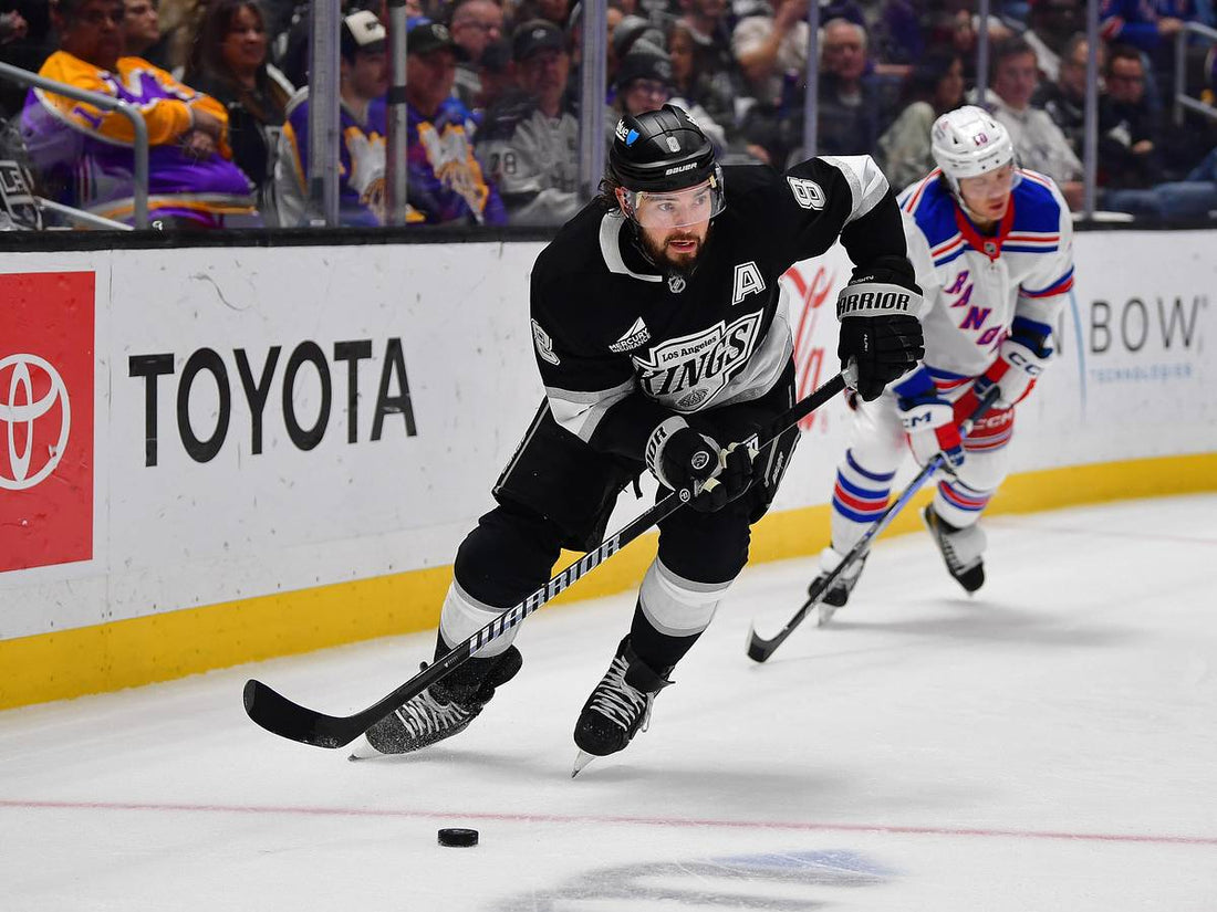 Drew Doughty skating in a Los Angeles Kings black and silver jersey