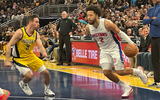 Cade Cunningham driving in a Detroit Pistons uniform during a November 2024 game; archival