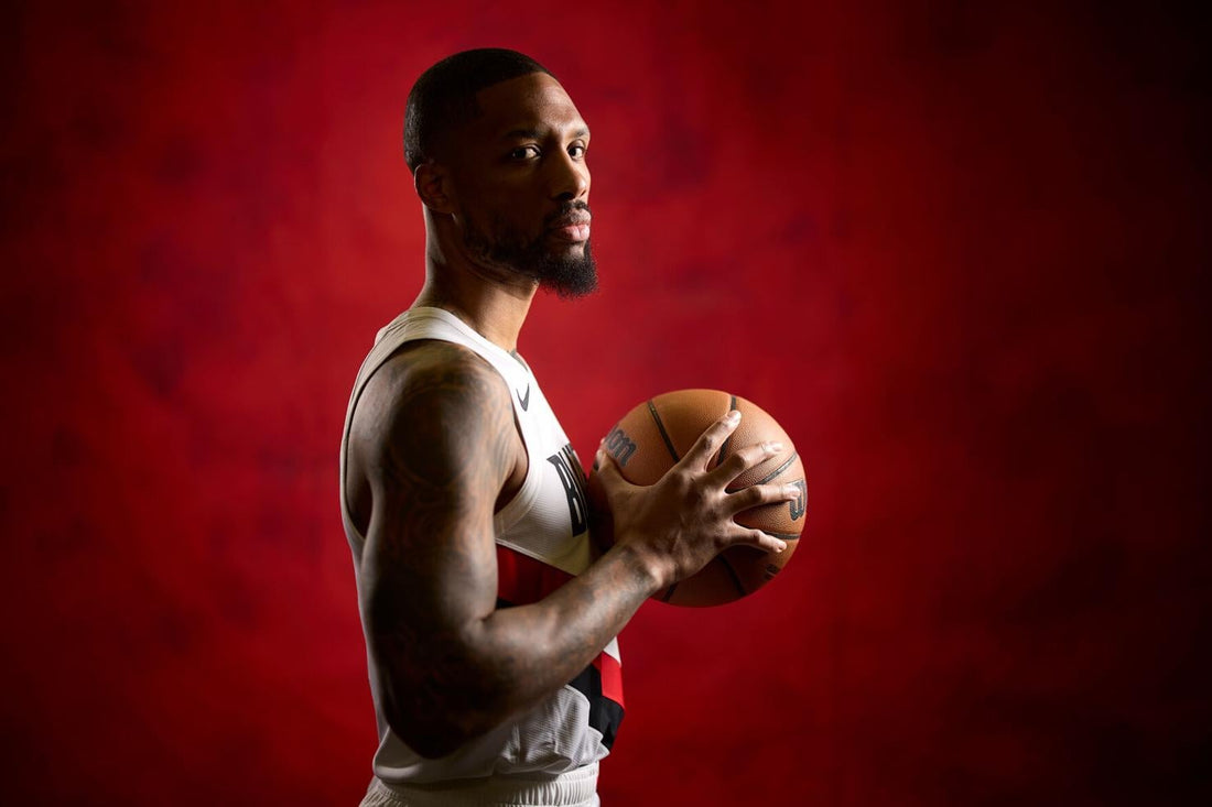Damian Lillard poses in Portland Trail Blazers uniform at 2026 media day