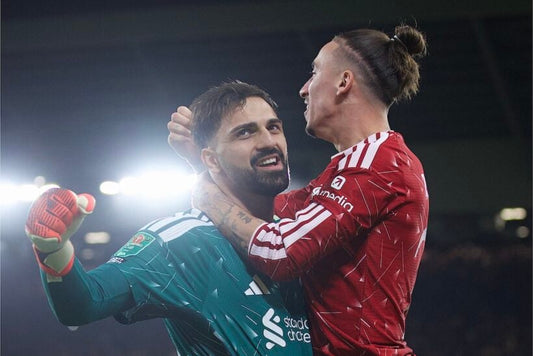 Giorgi Mamardashvili and Kostas Tsimikas celebrate Liverpool's shootout win over Chelsea