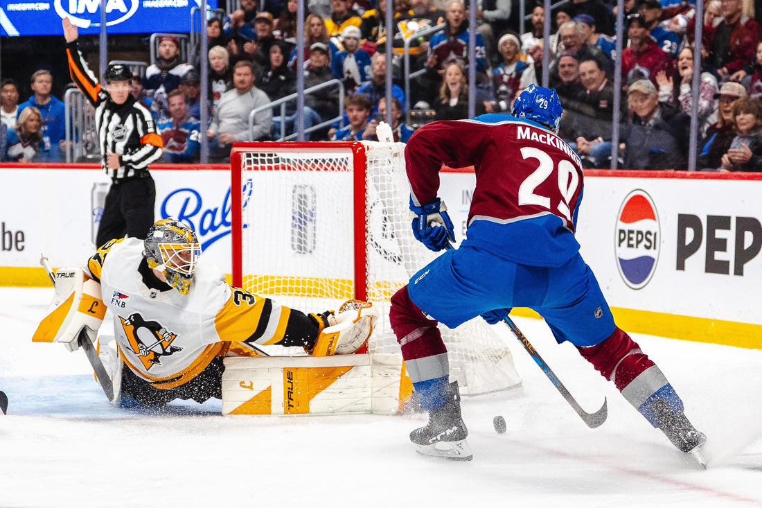 Nathan MacKinnon of the Colorado Avalanche attacks against Arturs Silovs of the Pittsburgh Penguins on October 16, 2026