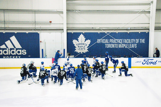 Toronto Maple Leafs players gathered during a team practice