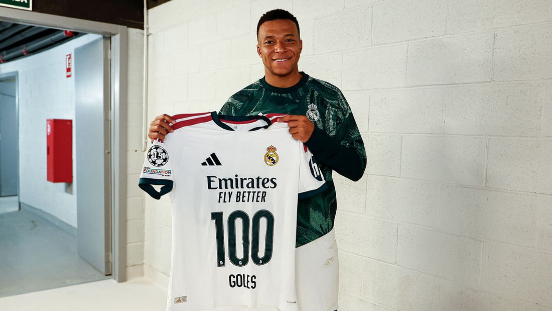 Kylian Mbappe holding a Real Madrid shirt marking his 100 club goals in October 2026