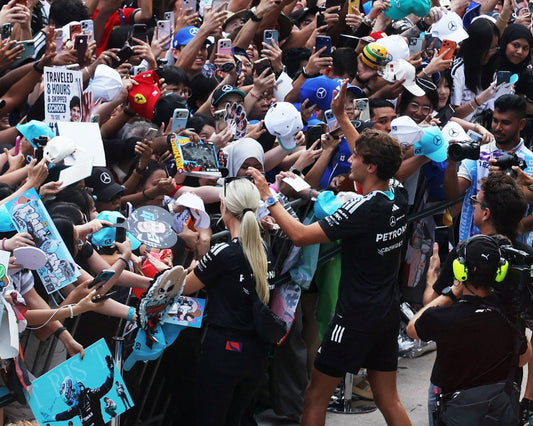 George Russell greeting fans at Sepang during the 2026 Formula 1 race weekend in Malaysia