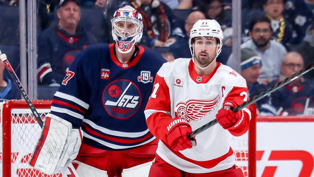 Connor Hellebuyck and Dylan Larkin during NHL action in 2026