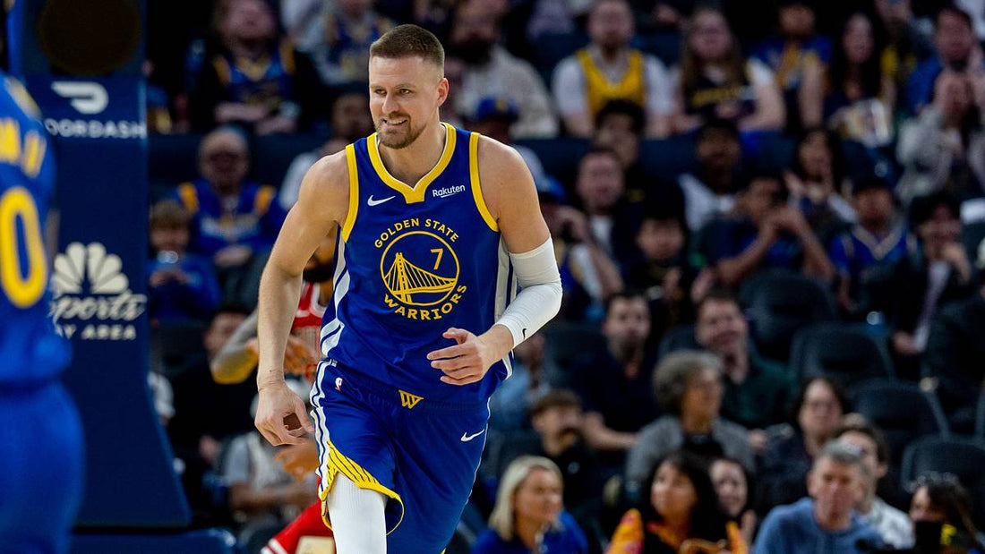 Kristaps Porziņģis in Golden State's blue and gold No. 7 jersey during a 2026 game