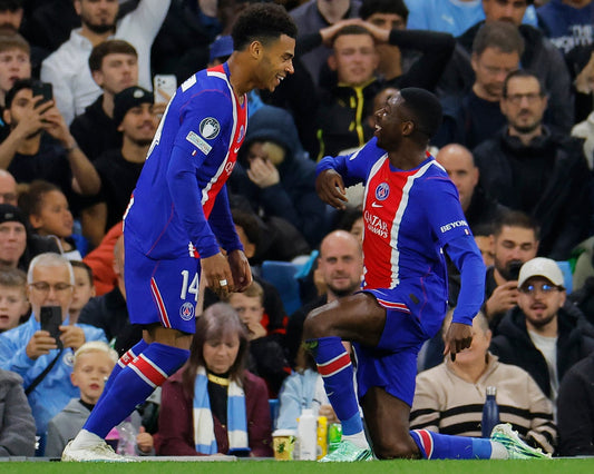 Désiré Doué and Ousmane Dembélé celebrate PSG's quick goals against Manchester City in the 2026 Champions League