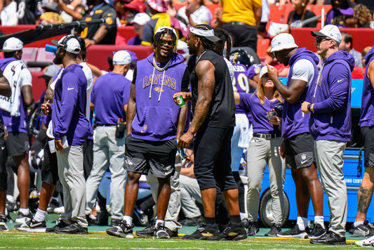 Lamar Jackson and Derrick Henry on the Baltimore Ravens sideline during 2025 preseason
