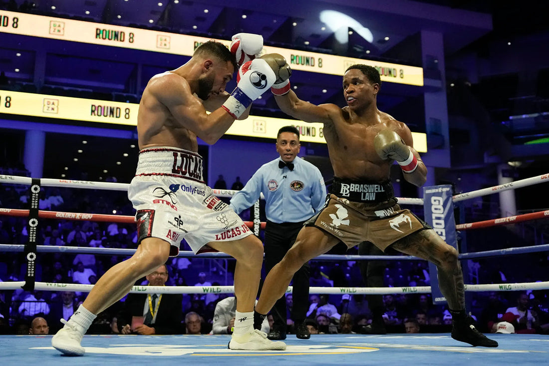 Floyd Schofield punches toward Lucas Bahdi in their October 10, 2026 WBA lightweight title fight