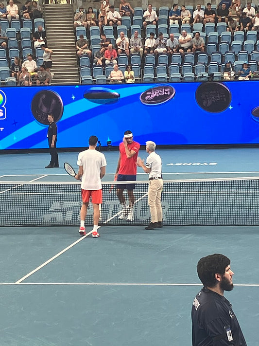 Hubert Hurkacz with Taylor Fritz on a tennis court at the 2026 United Cup, archival photograph