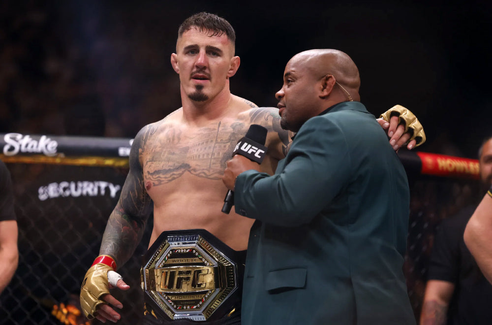 Tom Aspinall with the UFC heavyweight championship belt before vacating the title in 2026