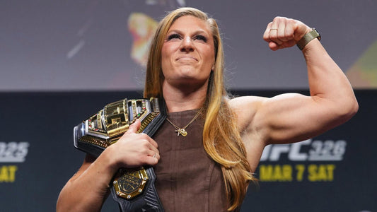 Kayla Harrison with UFC bantamweight title belt at a 2026 promotional appearance
