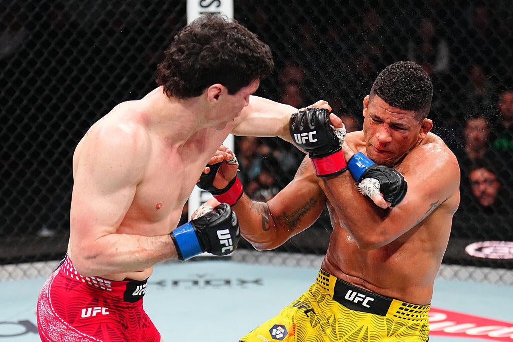 Mike Malott lands a punch against Gilbert Burns at UFC Winnipeg in April 2026