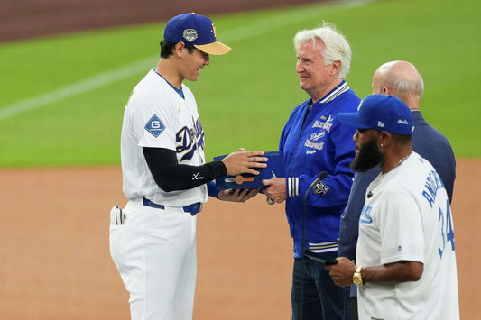 Dodgers owner Mark Walter presents Shohei Ohtani with a championship ring at Dodger Stadium in March 2026