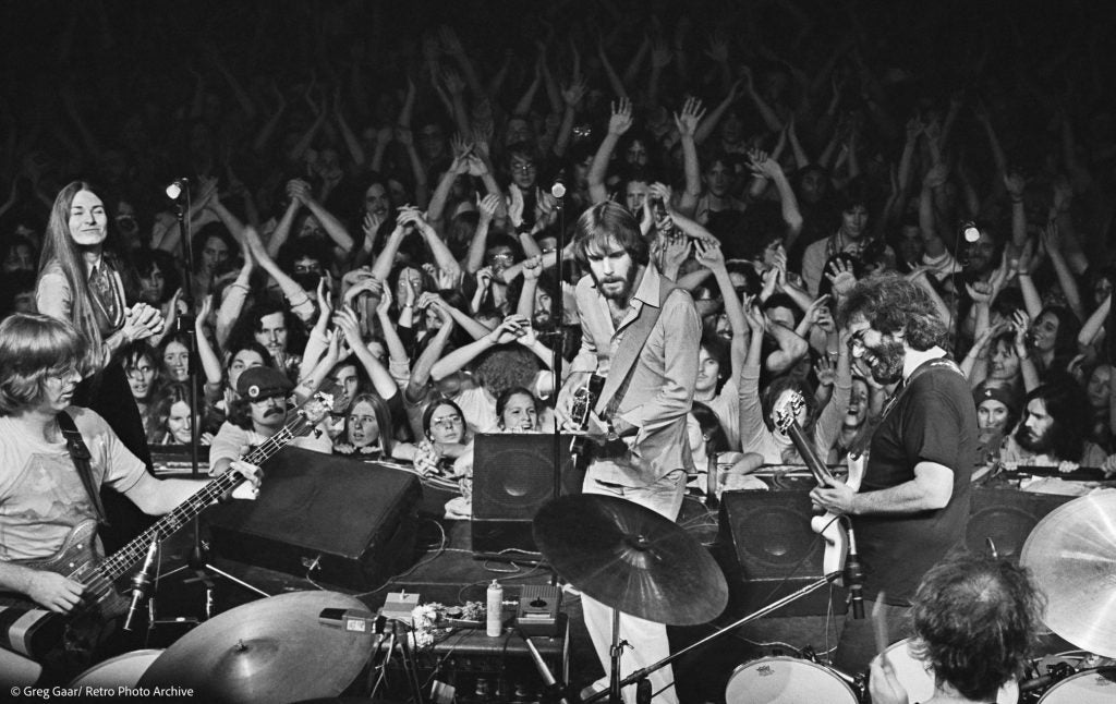 Grateful Dead performing live at Winterland as an audience watches a long-form rock jam