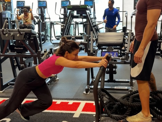 Soha Ali Khan performing a kettlebell squat in a gym workout