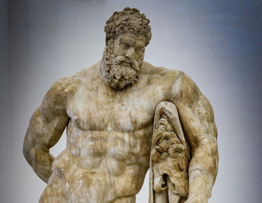 Classical marble statue of Hercules showing powerful abdominal and torso definition