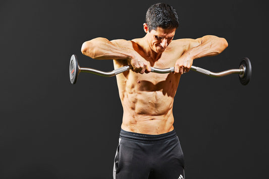 Jeff Cavaliere of ATHLEAN-X in his gym discussing exercise mechanics