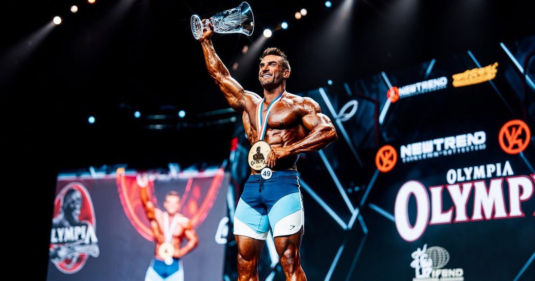 Ryan Terry celebrating his fourth Men's Physique Olympia championship onstage