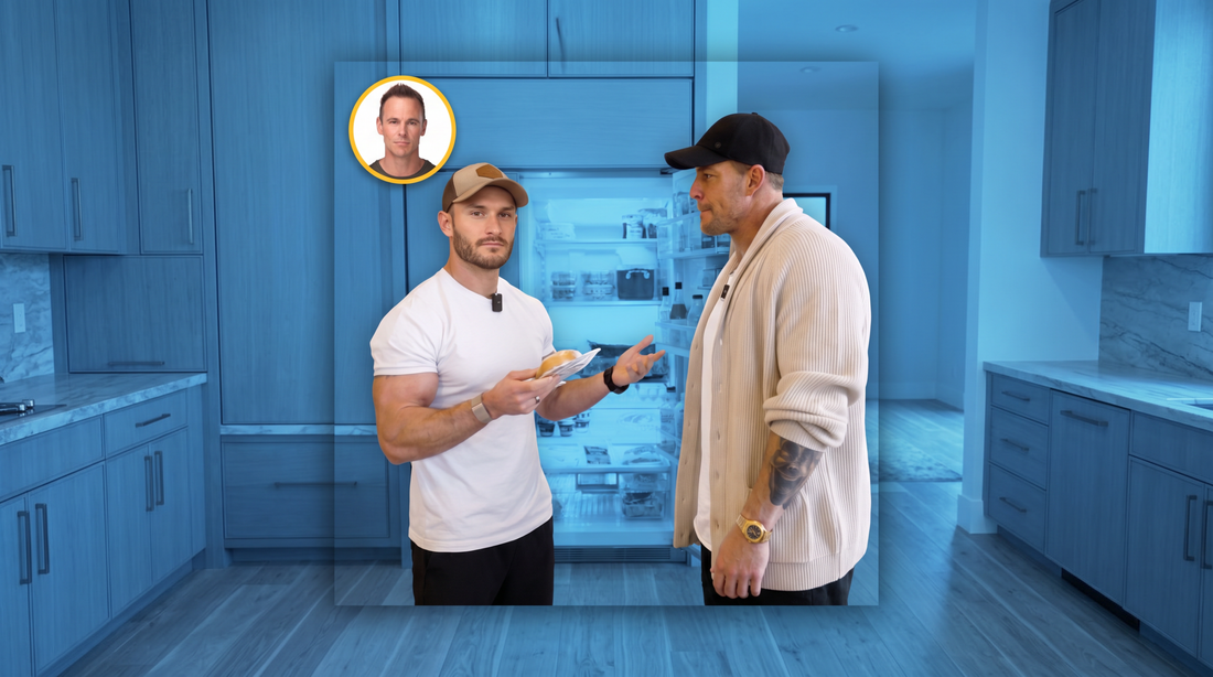 Alan Ritchson and Thomas DeLauer standing beside an open kitchen refrigerator