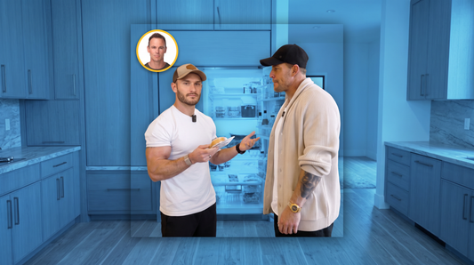 Alan Ritchson and Thomas DeLauer standing beside an open kitchen refrigerator