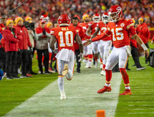 Tyreek Hill running in a Kansas City Chiefs uniform